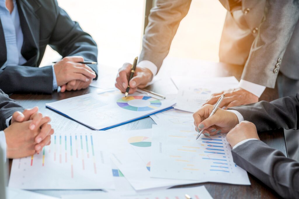 A group of professionals can be discussing the strategy to improve dealership profitability